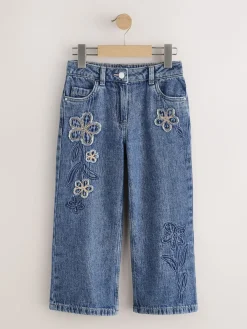 Clearance Next Bleu moyen - Jean orné d’un large imprimé fleuri (3-16ans) Coupe large